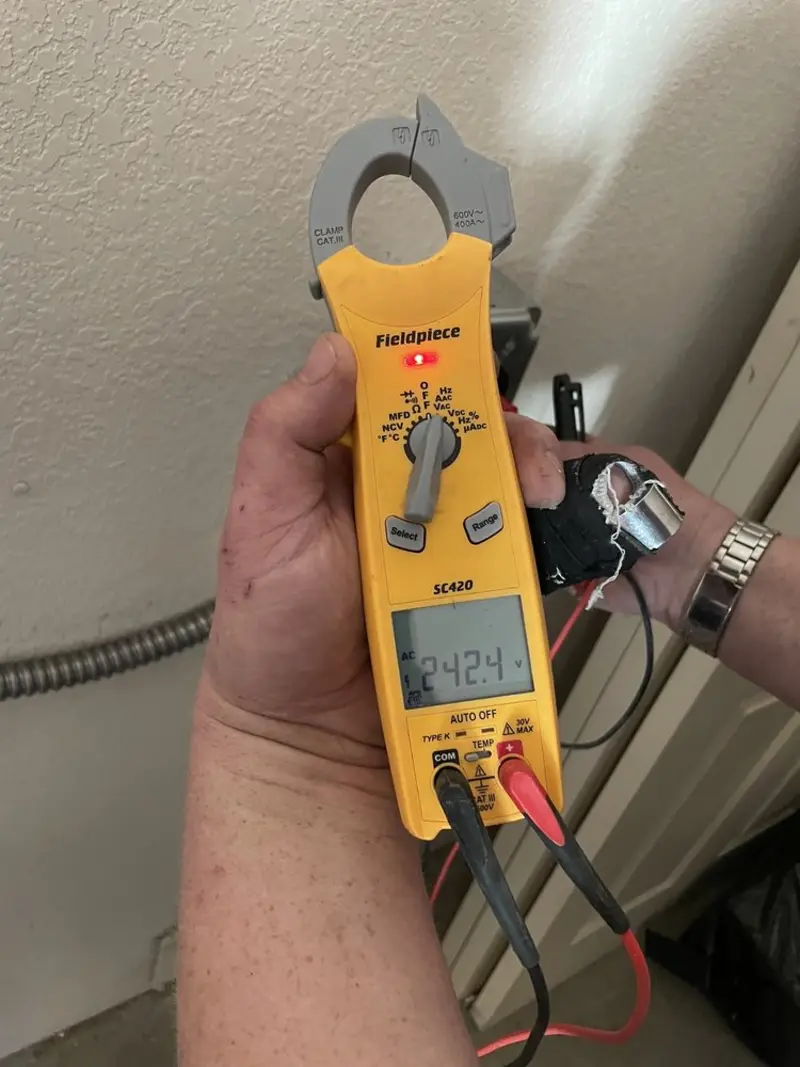 Voltage testing with clamp meter during Electrical Installation Services in St. Augustine South